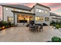 Spacious stamped concrete patio features a table with chairs perfect for outdoor entertaining at 920 Terramore Dr, Waxhaw, NC 28173