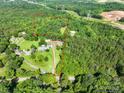 Expansive wooded lot, showcasing the property's privacy and natural surroundings at 12143 Asbury Chapel Rd, Huntersville, NC 28078