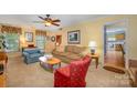 Inviting living room with neutral tones, comfortable seating, and warm lighting, ideal for gatherings at 13416 Kintyre Ct, Matthews, NC 28105