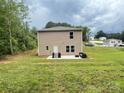 Spacious backyard with a patio, perfect for outdoor gatherings and relaxation at 1916 Country Way, Hickory, NC 28601