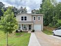 Inviting exterior of a two-story home with a garage and manicured front lawn at 1916 Country Way, Hickory, NC 28601