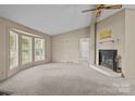 Bright living room features a fireplace and a bay window providing ample natural light at 200 Southwood Park Rd, Mooresville, NC 28117