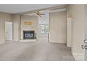 Inviting living room featuring a fireplace and a large opening to another room at 200 Southwood Park Rd, Mooresville, NC 28117