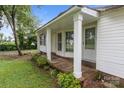 Covered front porch with decorative pillars offers a welcoming entrance to the home at 200 Southwood Park Rd, Mooresville, NC 28117