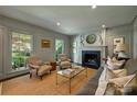 Comfortable living room featuring a fireplace, neutral colors, and natural light at 2011 Fromby Ct, Charlotte, NC 28211