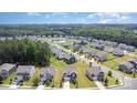 Beautiful neighborhood with lush greenery and well-maintained homes at 205 Falls Cove Dr, Troutman, NC 28166