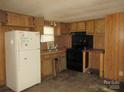 Classic kitchen featuring standard appliances and wooden cabinetry at 2927 S Nc 16 Hwy, Newton, NC 28658