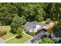 A captivating aerial view highlighting the property's landscaping, charming elevation, and proximity to lush greenery at 3307 Draper Ave, Charlotte, NC 28205