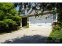 Charming home featuring a two-car garage, landscaped yard, and inviting curb appeal at 4003 Northerly Island Ct, Gastonia, NC 28056
