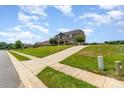 A beautiful two-story home sits on a well-maintained lawn with an inviting driveway at 410 Alucio Ct, Matthews, NC 28104
