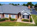 Aerial view of the brick home, showing landscaping and neighborhood streets at 8538 Highland Glen Dr, Charlotte, NC 28269