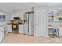 Well-lit kitchen featuring stainless steel appliances, granite countertops, and ample cabinet space at 10043 Elsenham Ln, Charlotte, NC 28269