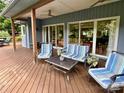 Relaxing outdoor deck space with comfortable seating and sliding glass doors into the home at 106 Boyter Ct, Cramerton, NC 28032