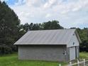 View of detached garage with a metal roof and room for two cars at 1150 Wyatt Grove Church Rd, Gold Hill, NC 28071