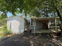 Backyard with a covered carport and ramp, offering practical convenience and accessibility at 1317 Moretz Ave, Charlotte, NC 28206