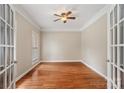 Office space with hardwood floors, neutral paint, transom window and french doors for professional appeal at 1812 Mill Chase Ln, Waxhaw, NC 28173