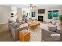 Bright, open living room with a fireplace, large windows, and comfortable seating at 2027 Brook View Ct, Matthews, NC 28104