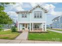 Inviting two-story home featuring a charming front porch with stylish decor and curb appeal at 257 Auburn View Rd, Rock Hill, SC 29730