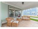 Cozy front porch with wicker furniture set, perfect for relaxing outdoors at 257 Auburn View Rd, Rock Hill, SC 29730