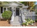 Inviting front entrance with stone steps, brick facade, and well-manicured landscaping at 3035 Florida Ave, Charlotte, NC 28205