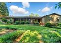 Inviting single-story home with a covered front porch, mature landscaping, and a well-maintained lawn at 3135 Lake Shore S Rd, Denver, NC 28037