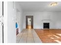 Inviting living room featuring a fireplace and combination tile and wood flooring at 317 Campus St, Charlotte, NC 28216