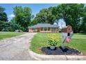 Beautiful front exterior with brick and stone accents, and manicured lawn with a welcoming mailbox at 318 W Peeler St, Salisbury, NC 28146