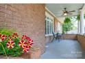 Inviting front porch featuring a ceiling fan and seating area, perfect for relaxation at 318 W Peeler St, Salisbury, NC 28146