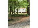 A utility shed is hidden among the trees on this property, adding extra storage for your equipment at 3910 Winter Rd, Rock Hill, SC 29730