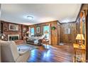 Charming living room with a brick fireplace and beautiful hardwood floors at 4004 Stillwater Ct, York, SC 29745