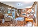 Cozy living room with wood paneling, fireplace, and hardwood floors at 4004 Stillwater Ct, York, SC 29745