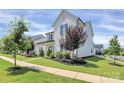 Charming white home with a neatly landscaped front yard and a welcoming pathway at 5129 Whitman Ave, Matthews, NC 28105