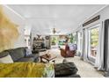Spacious living room featuring a cozy fireplace, large windows, and comfortable seating perfect for relaxation at 5425 Creek Run Ct, Kings Mountain, NC 28086