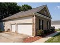 Spacious two-car garage with brick and vinyl siding at 126 Doyle Farm Ln, Mooresville, NC 28115