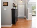 Bright foyer showcasing hardwood floors, neutral walls, and a view of the entrance with natural light at 1308 Stonewyck Dr, Salisbury, NC 28146