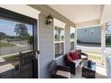 Cozy front porch with comfortable seating and decorative details at 146 Kerri Dawn Ln, Locust, NC 28097