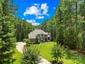 A charming home surrounded by lush trees, offering privacy and a serene setting at 168 Blue Ridge Trl, Mooresville, NC 28117