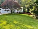 Front yard view of the home showing the manicured lawn and landscaping at 1920 Waldeck Ct, Mount Pleasant, NC 28124