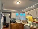 Cozy kitchen with light-colored cabinets, modern appliances, and a bright window at 1920 Waldeck Ct, Mount Pleasant, NC 28124