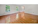 Inviting living room boasts gleaming hardwood floors and two windows offering natural light at 2020 Dawnshire Dr, Gastonia, NC 28054