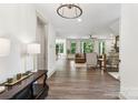 Open-concept living room featuring hardwood floors and neutral color palette at 416 Plantation Way # 3, Mount Gilead, NC 27306