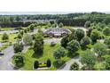 Aerial shot of a community center with pool, parking, and manicured landscaping at 4263 Rambling Rose Ln # 23, Rock Hill, SC 29732