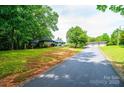 Sprawling property with a long driveway leading to a stone-clad house and a detached three-car garage at 4275 Herman Sipe Rd, Conover, NC 28613