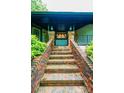 Inviting front entrance with brick steps, lantern-style lighting, and well-maintained landscaping at 4275 Herman Sipe Rd, Conover, NC 28613