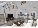 Bright, open-concept living room with stairs, modern furnishings, and plenty of natural light at 512 North Mulberry St, Cherryville, NC 28021