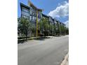 Contemporary condominium building with landscaped frontage and mature trees at 514 W 10Th St # 403, Charlotte, NC 28202