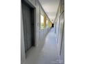 Well-lit condo hallway with elevator access and bright yellow window accents at 514 W 10Th St # 403, Charlotte, NC 28202