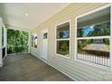 Covered porch featuring ample space and natural light, perfect for outdoor relaxation at 54 Reed Ne St, Concord, NC 28025