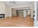 Open concept living space with hardwood floors, fireplace, and seamless flow to the modern kitchen at 6249 Hayden Dr, Hickory, NC 28601