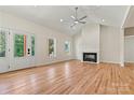 Bright living room features hardwood floors, fireplace, and high ceiling, creating a spacious atmosphere at 6249 Hayden Dr, Hickory, NC 28601